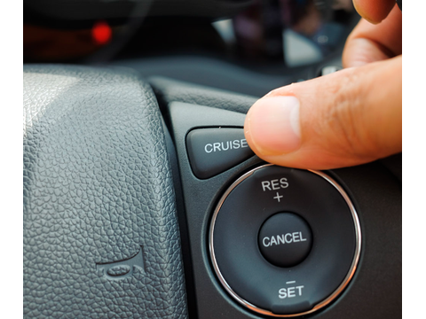 Never — do not use cruise control in poor weather conditions — Alberta adverse-conditions road sign for Class 7 test