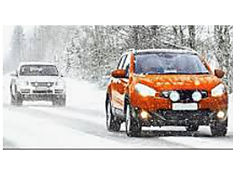 In adverse conditions such as rain, snow, ice, heavy traffic, or when following a large vehicle — Alberta safe-driving road sign for Class 7 test