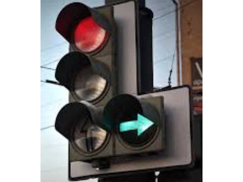 May proceed, without stopping if safe, in the direction of the arrow — Alberta traffic-signals road sign for Class 7 test