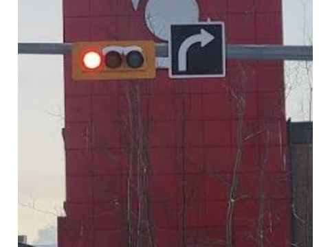 Signal, ensure there is no sign prohibiting the turn, stop, look left and right, yield right of way, then proceed — Alberta traffic-signals road sign for Class 7 test